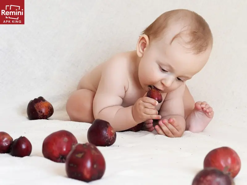 Photographing Your Baby's Milestones – A First Year Photoshoot 11 baby playing with fruits