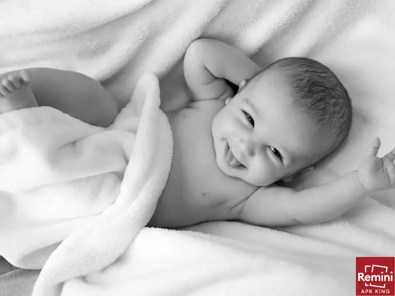 Photographing Your Baby's Milestones – A First Year Photoshoot 13 smiling baby with towel